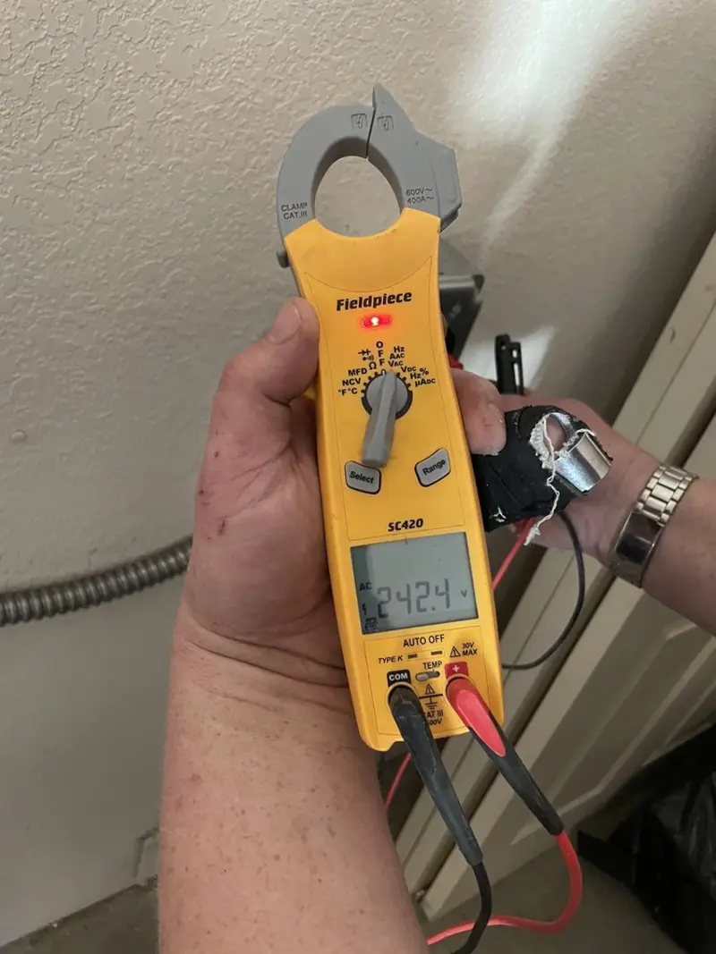 Voltage testing with clamp meter during Electrical Installation Services in Sellersville